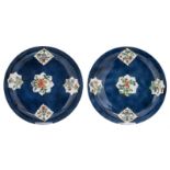 Two Chinese bleu poudré dishes, the roundels famille verte, decorated with antiquities and flower