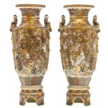 A fine pair of Japanese Satsuma and relief decorated vases on ditto soccles, late Edo period, H