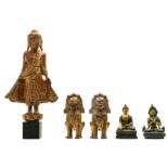 A pair of Oriental gilt bronze temple guards and a ditto patinated seated Buddha and a