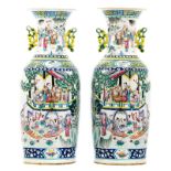 A pair of Chinese famille rose overall decorated vases with an animated court scene, 19thC, H 61 cm