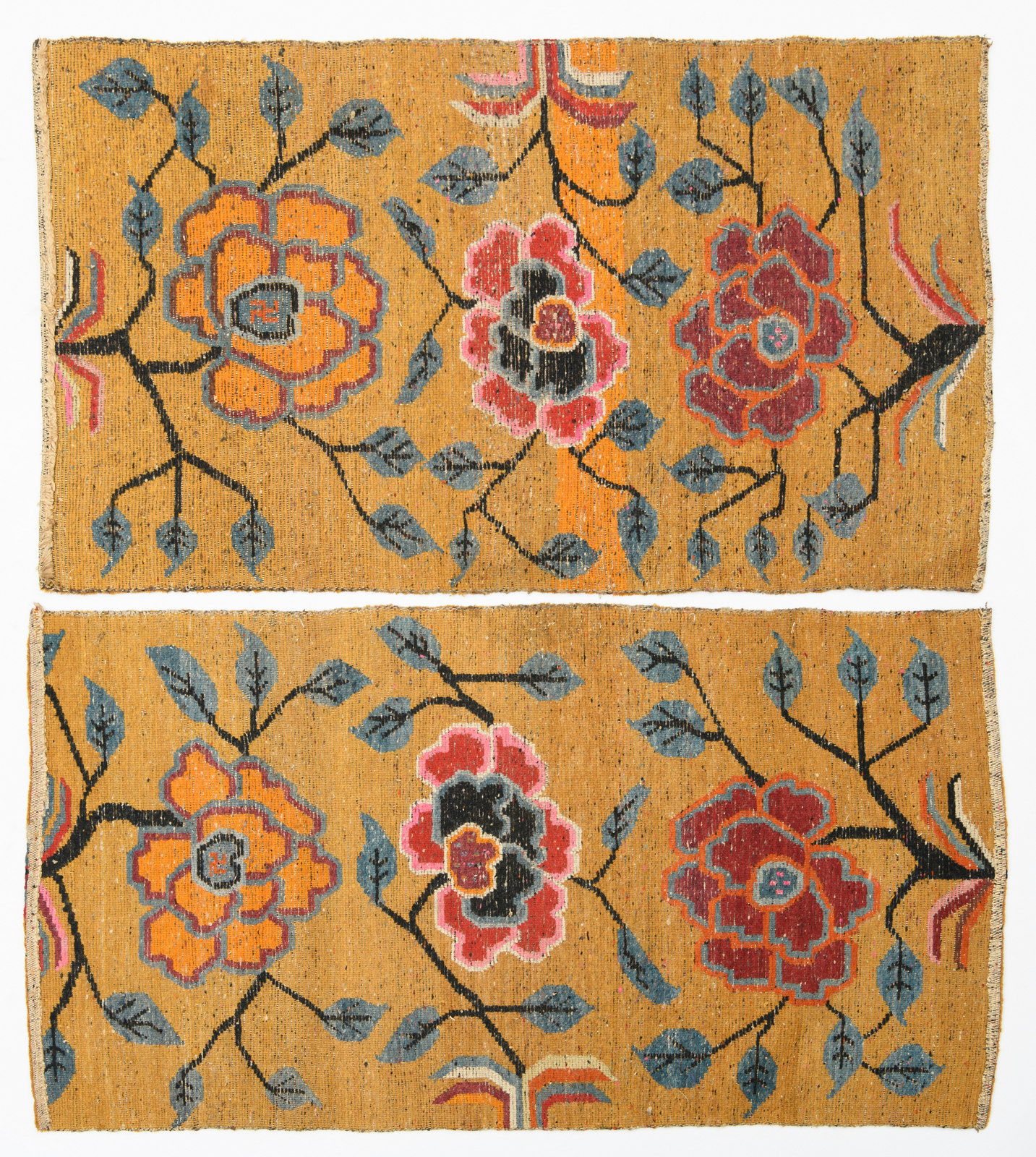 A pair of Sino-Tibetan carpets, wool on cotton, with styled floral motifs, 63 x 85 and 66 x 88 cm - Image 2 of 4