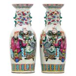 A pair of Chinese famille rose and polychrome decorated vases with figures and bats, 19thC, H 59,5