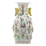 A Chinese famille rose and relief decorated vase with antiquities, flower branches and birds, 19thC,