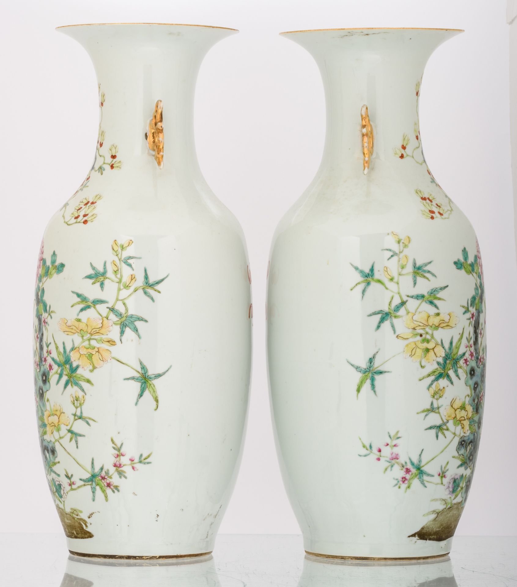 A pair of Chinese famille rose decorated vases with flower branches on a rock and bats, marked, H 58 - Image 4 of 6