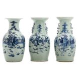 Three Chinese celadon ground blue and white decorated vases with figures in a garden landscape, H