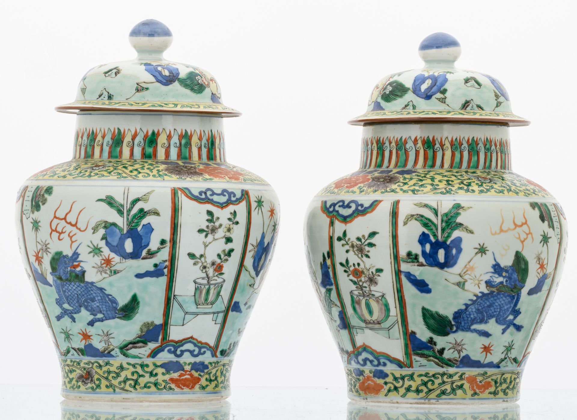 A pair of Chinese wucai overall floral decorated vases and covers with Fu lions, 17th/18thC, H 37, - Image 2 of 8