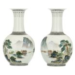 A pair of Chinese polychrome decorated bottle vases with figures and pavillions in a mountainous