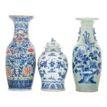 A Chinese celadon ground blue and white decorated vase with a phoenix, a rock and flower branches,