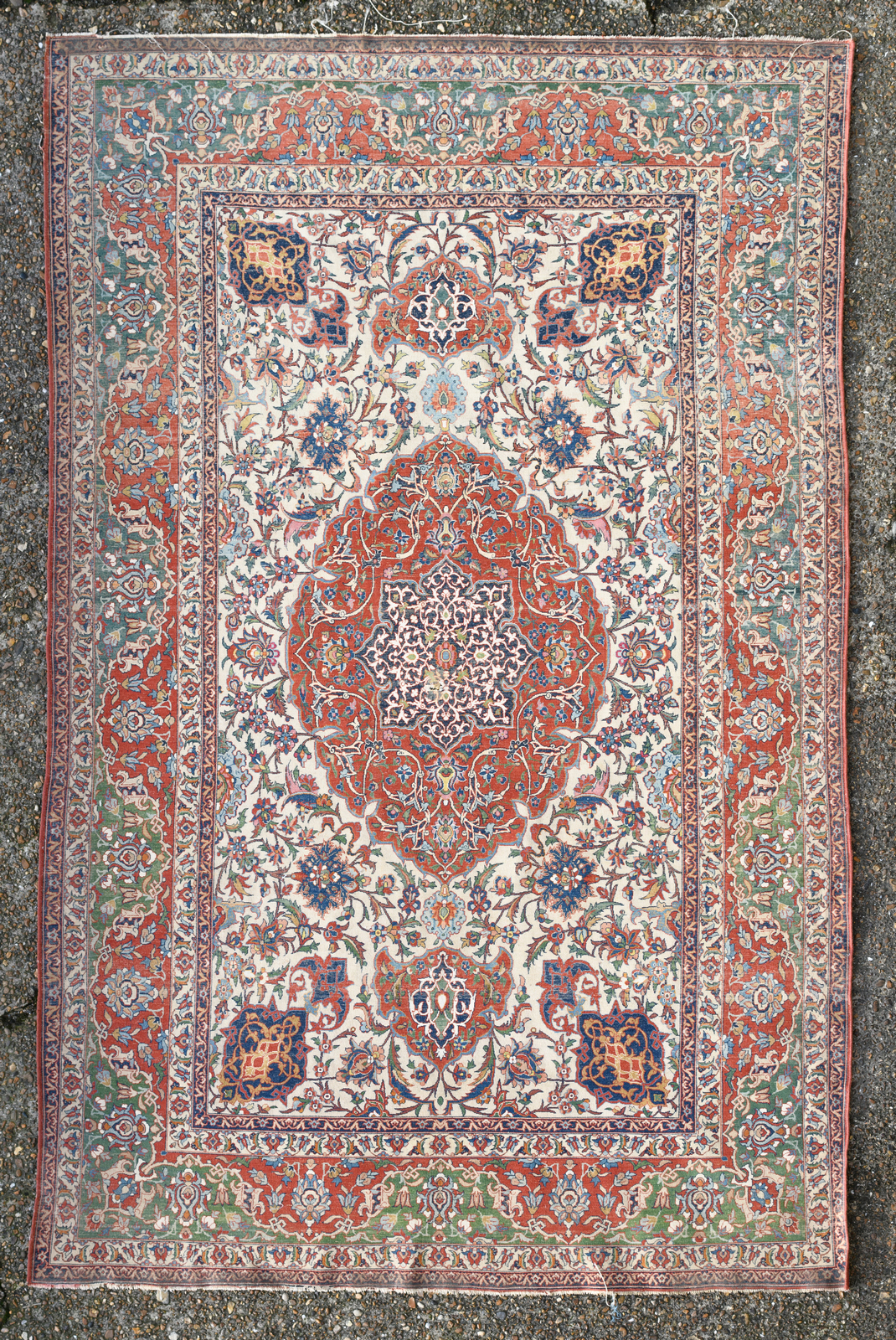 A fine Persian rug, wool and silk on cotton, decorated with floral motifs and a central medallion, - Image 2 of 4