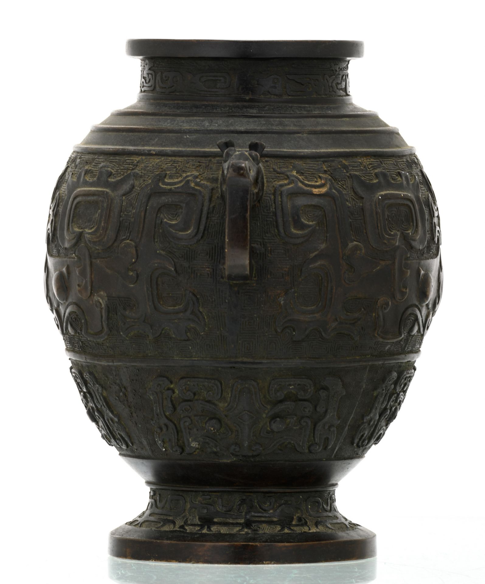A Chinese bronze archaic vessel, relief decorated with taoti, the handles dragon shaped, about 1900, - Image 4 of 6