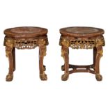 A pair of Chinese carved and polychrome decorated gilt hardwood stools with a marble top, H 45 - ø