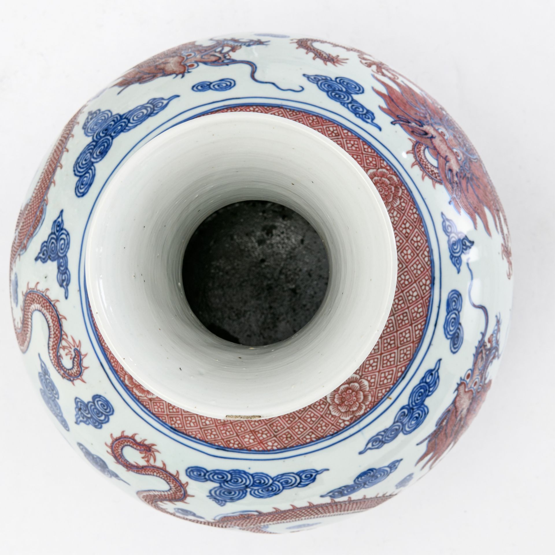 A Chinese cobalt blue underglazed and copperred glazed dragons amongst clouds decorated vase with - Image 5 of 6