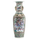 An impressive Chinese famille rose floral and relief decorated vase with dragons and Fu lions, the