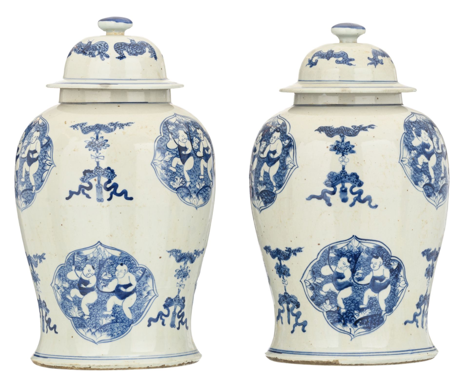 A pair of Chinese blue and white decorated vases and covers with auspicious symbols, the roundels