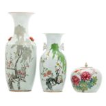 Two Chinese famille rose vases and a ditto ginger jar and cover, decorated with flower branches