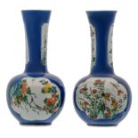 Two Chinese bleu poudré ground bottle vases, the roundels famille verte, decorated with rocks,