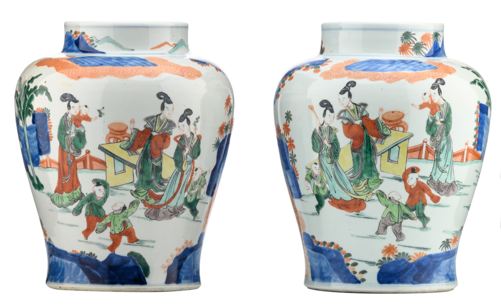 A pair of Chinese wucai vases, overall decorated with ladies and playing children in a garden, H