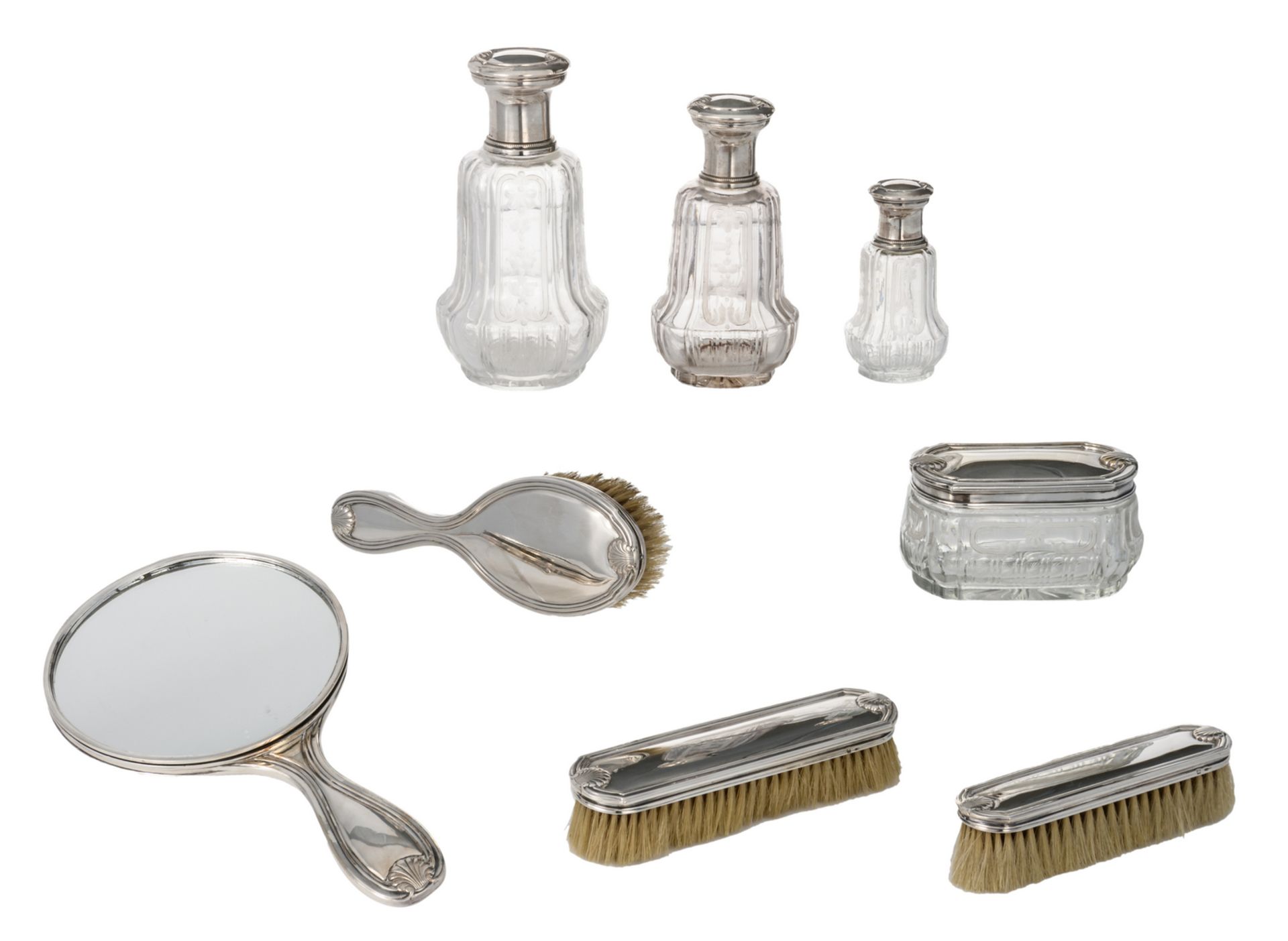 An eightpiece silver ladies vanity dressing table garniture, silver mounts and crystal, produced