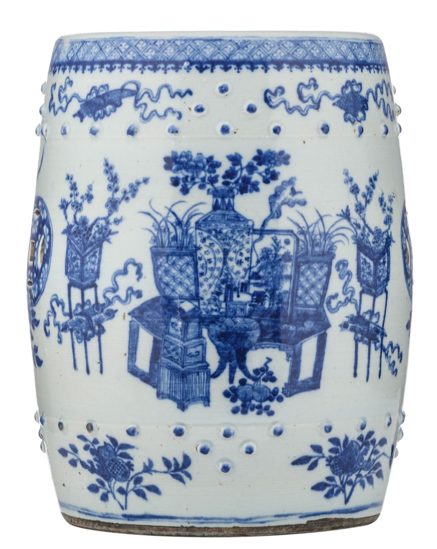 A Chinese blue and white garden seat, overall decorated with antiquities, flower branches and