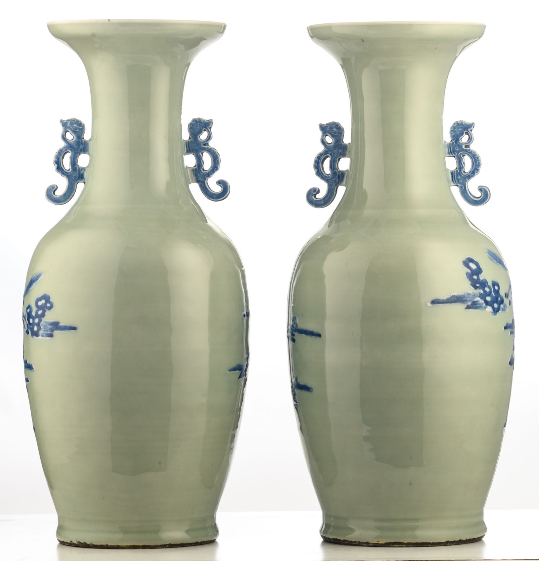A pair of Chinese celadon ground blue and white vases, decorated with horses in a landscape, H 60 - Bild 3 aus 6