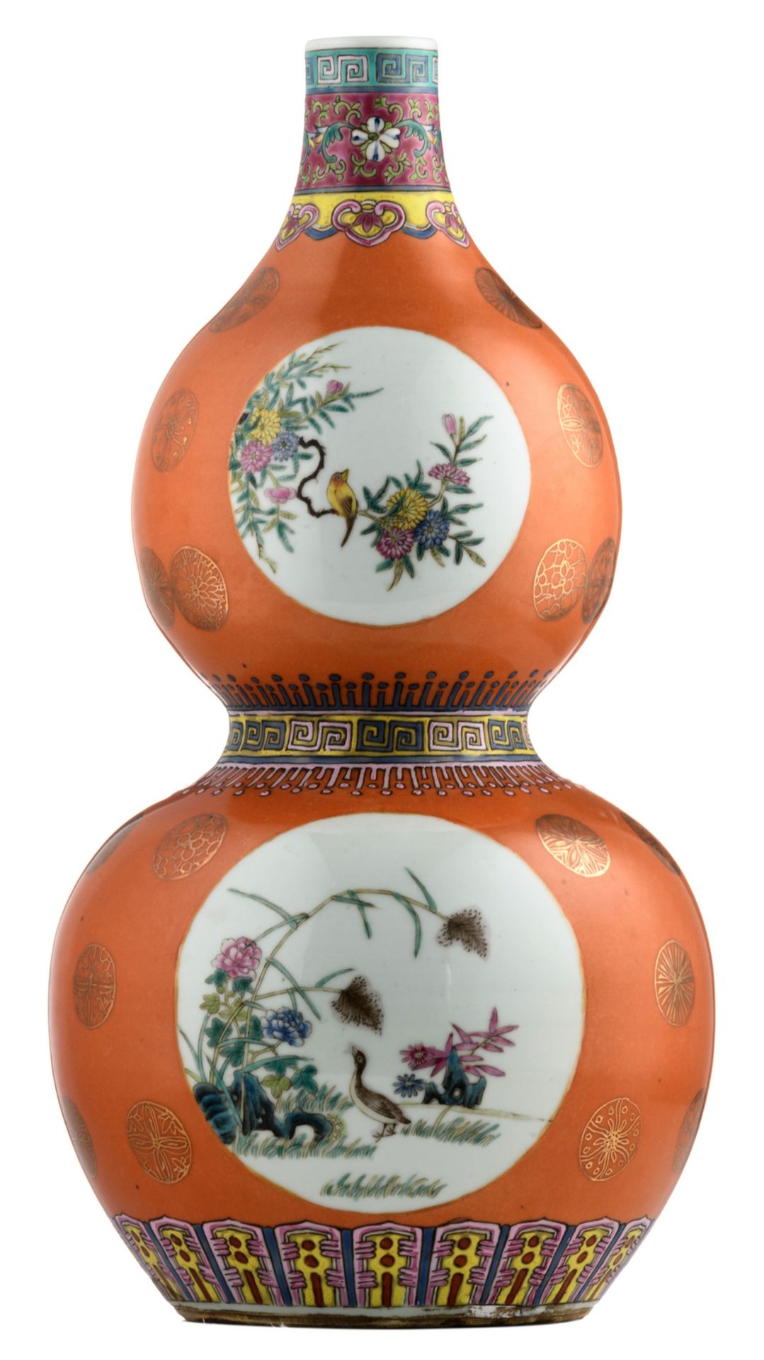 A Chinese orange ground famille rose double gourd vase, the roundels decorated with birds and flower
