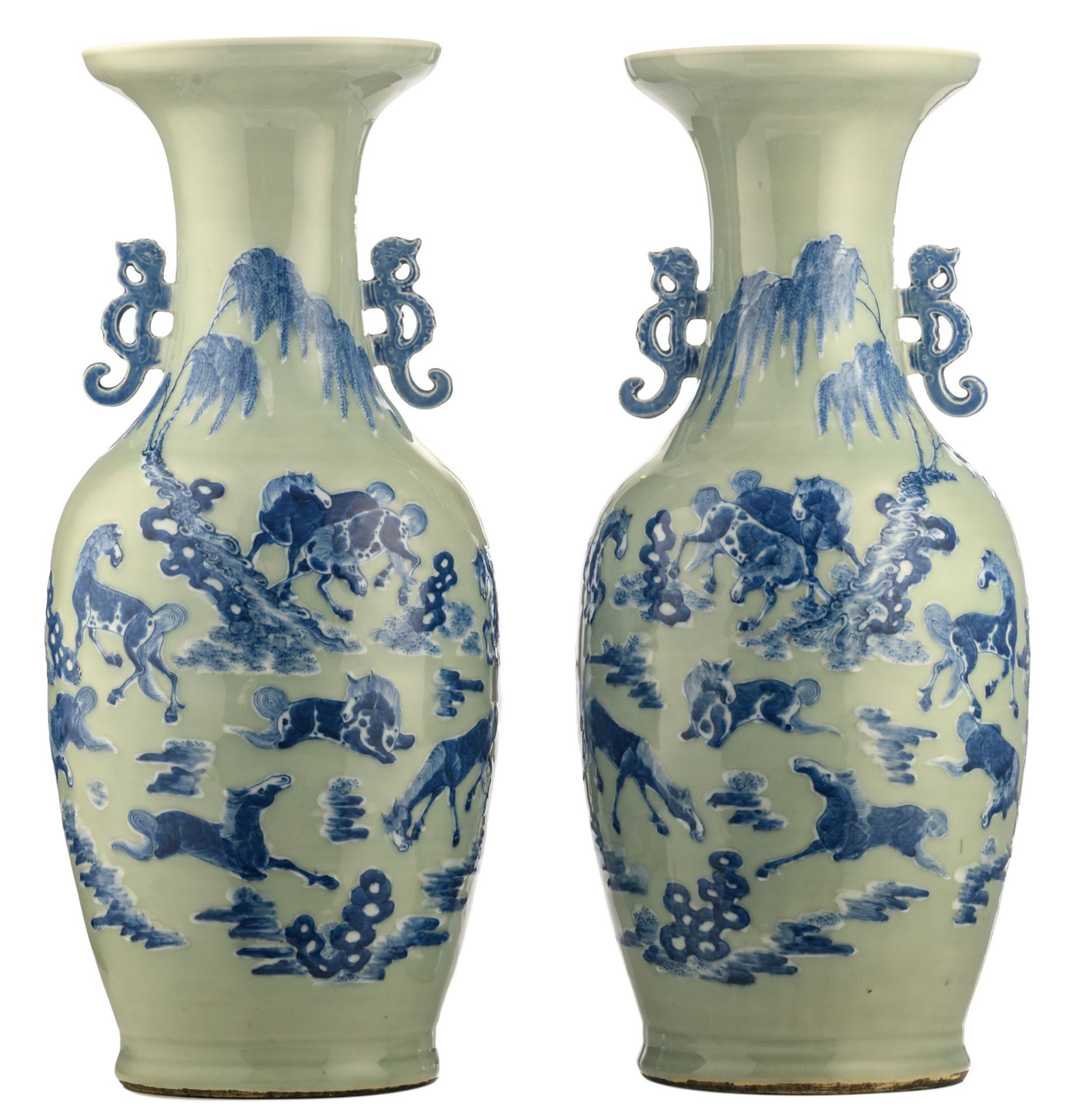 A pair of Chinese celadon ground blue and white vases, decorated with horses in a landscape, H 60