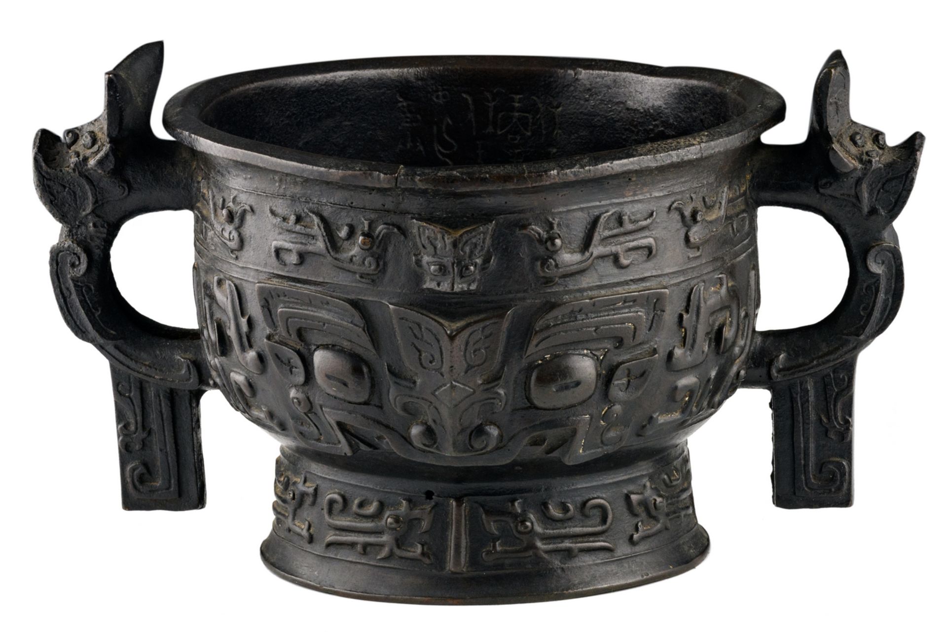 A Chinese bronze archaic vessel, relief decorated with taotie and calligraphic text inside, Ming,