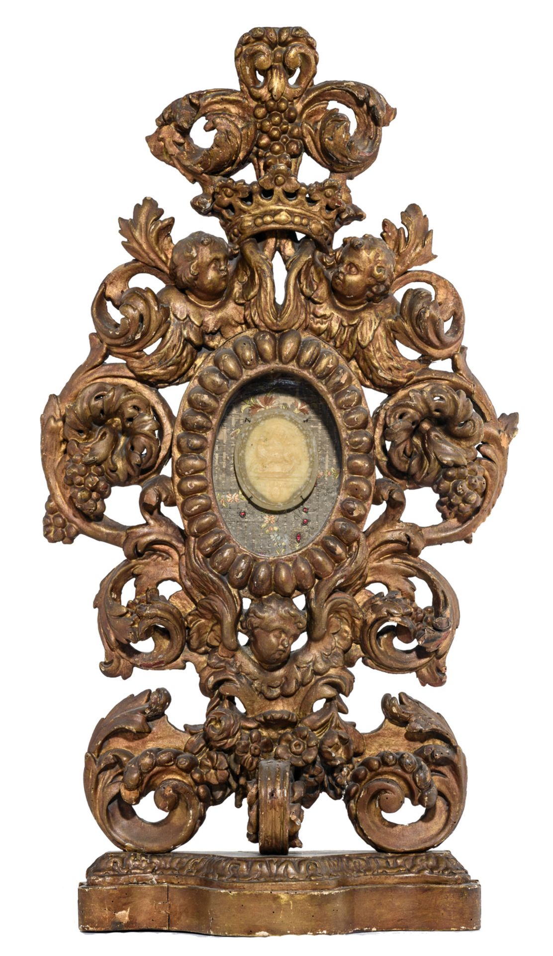 A late 17th - early 18thC gilt limewood reliquary with a wax relief of the Mystic Lamb, H 77 cm