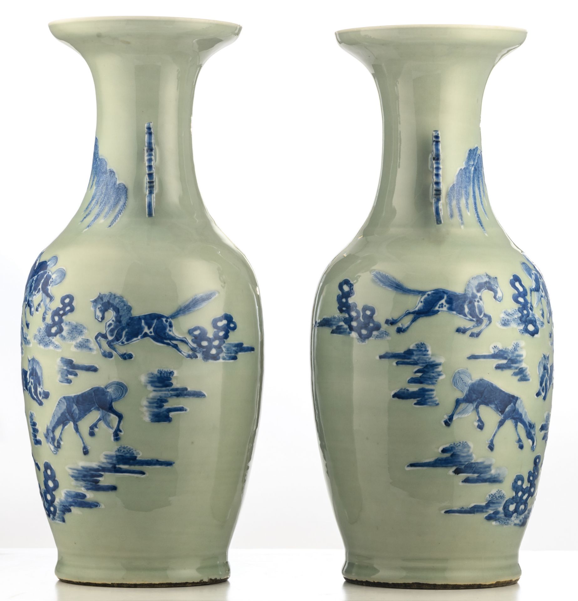 A pair of Chinese celadon ground blue and white vases, decorated with horses in a landscape, H 60 - Bild 4 aus 6