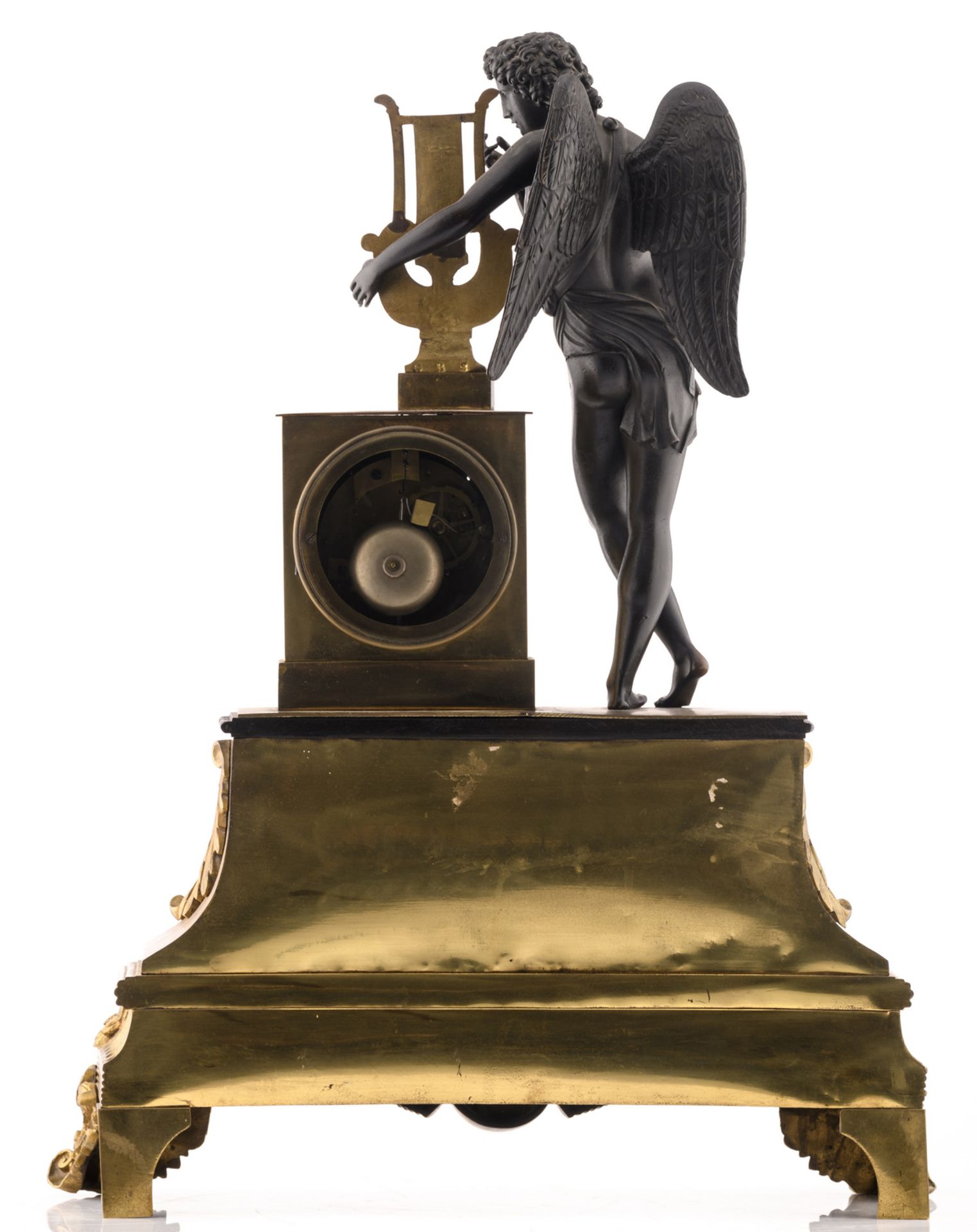 A third quarter of the 19thC gilt and patinated bronze mantle clock with on top Apollo with kithara, - Bild 2 aus 3