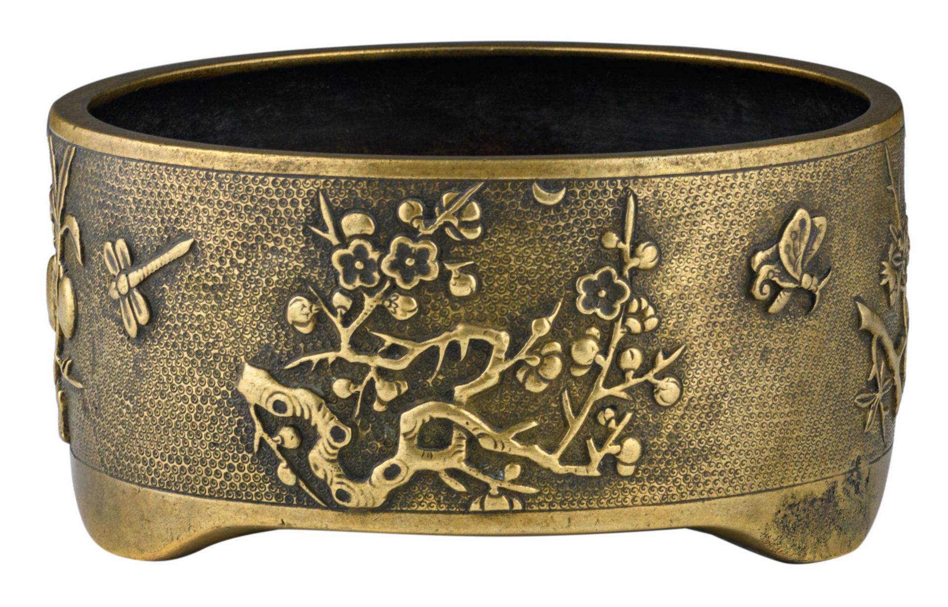 A Chinese bronze relief decorated tripod incense burner with flower branches, butterflies and