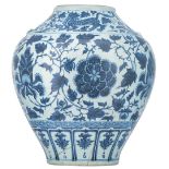 A Chinese blue and white vase, decorated with scrolling lotus and Fu lions, H 45,5 cm