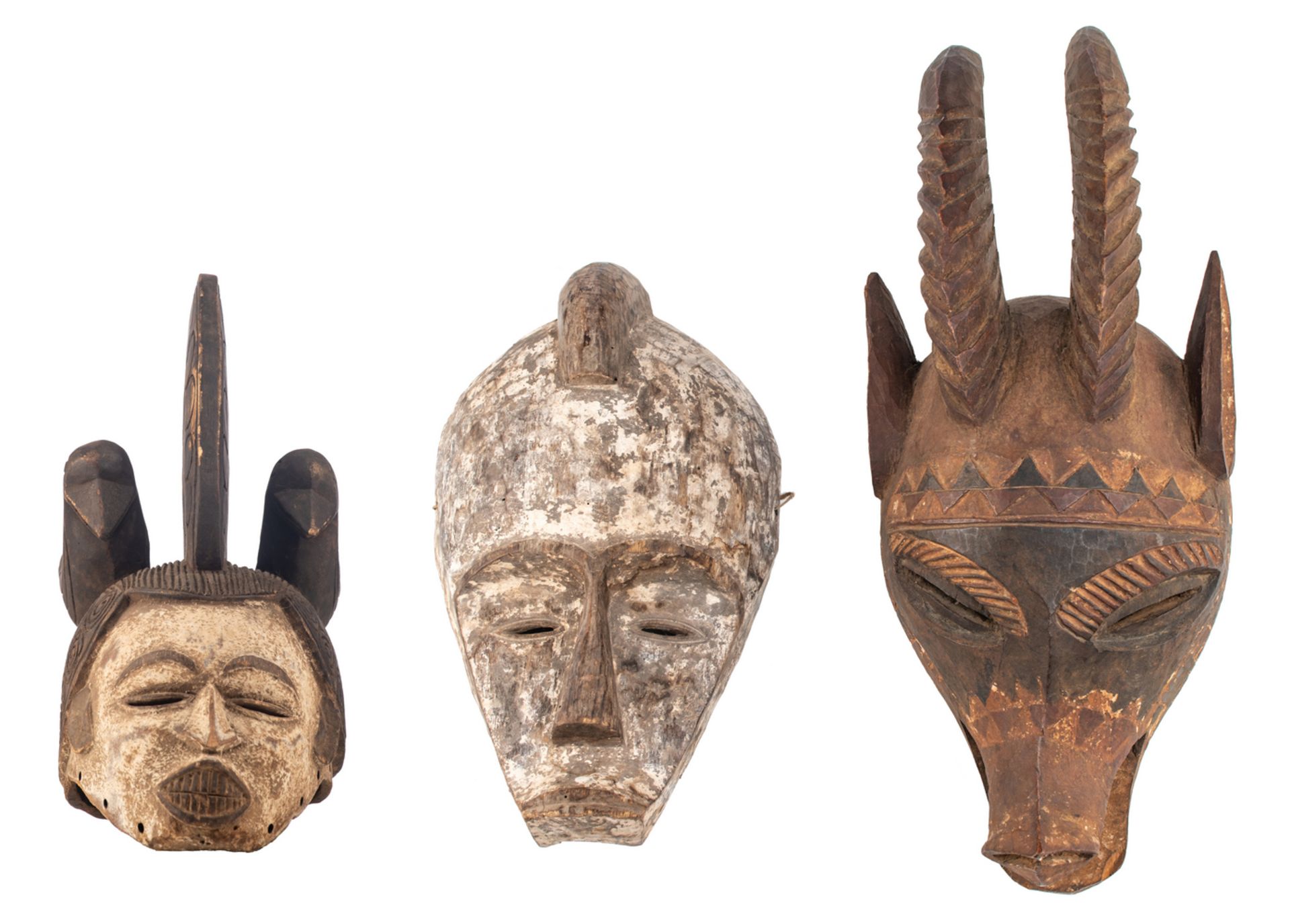 Three polychrome decorated African wooden masks, different regions and tribes (e.g. Fang - Gabon), H