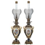 A pair of French Neoclassical electrified oil lamps with gilt bronze mounts, the front roundels