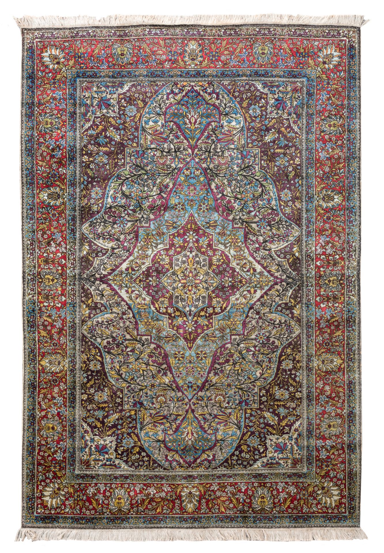 An Oriental floral decorated silk carpet with a central medallion, 135 x 203 cm