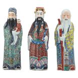 Three Chinese polychrome decorated figures, depicting Fu, Lu and Shou Xing, all figures marked,