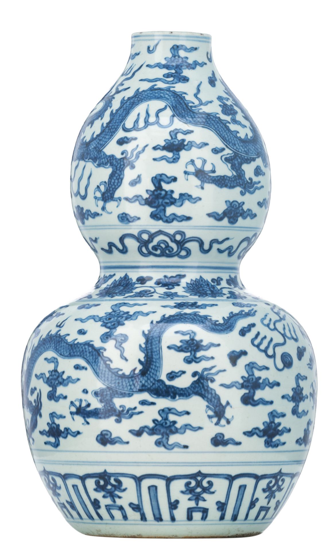 A Chinese blue and white double gourd vase, decorated with dragons and flaming pearls amid clouds, H