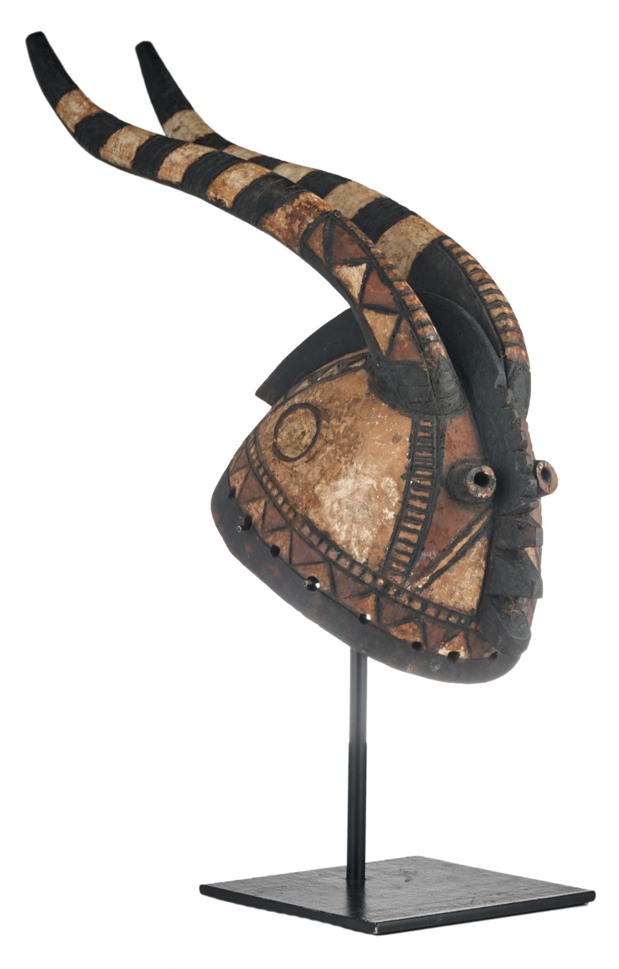 A traditional polychrome decorated African wooden Sukomse helmet mask, Mossi - Burkina Faso, H 17