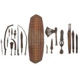 A collection of African - Congolese tribal weapons, a Songye axe and a Northern Congolese shield,