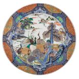 A Meiji Japanese Imari charger depicting cranes in a river landscape, marked, ø 52 cm