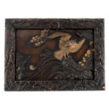 A Japanese alto relievo patinated bronze plaque, depicting an eagle in a river landscape, signed,