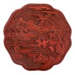 A Chinese red cinnabar lacquered scalloped box and cover, the cover decorated with figures on a