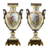 A pair of imposing Sèvres type vases with cream coloured ground, the gilt roundels decorated on