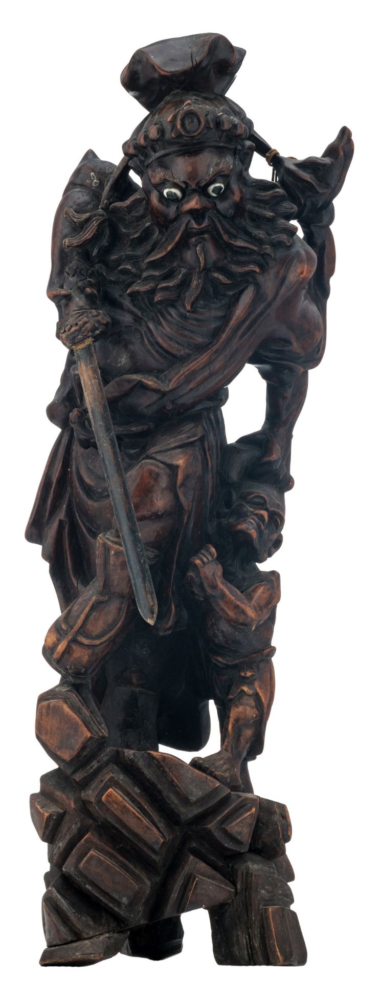 A Chinese carved hardwood group, depicting a warrior-god and a vanquished, H 54,5 cm