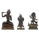 Three Sino-Tibetan bronze figures depicting Buddha, with traces of polychromy, H 16,5 - 20,5 cm