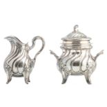A Belgian silver Rococo style sugar pot and cream jar, Belgian hallmarks between 1868 - 1942, 950/