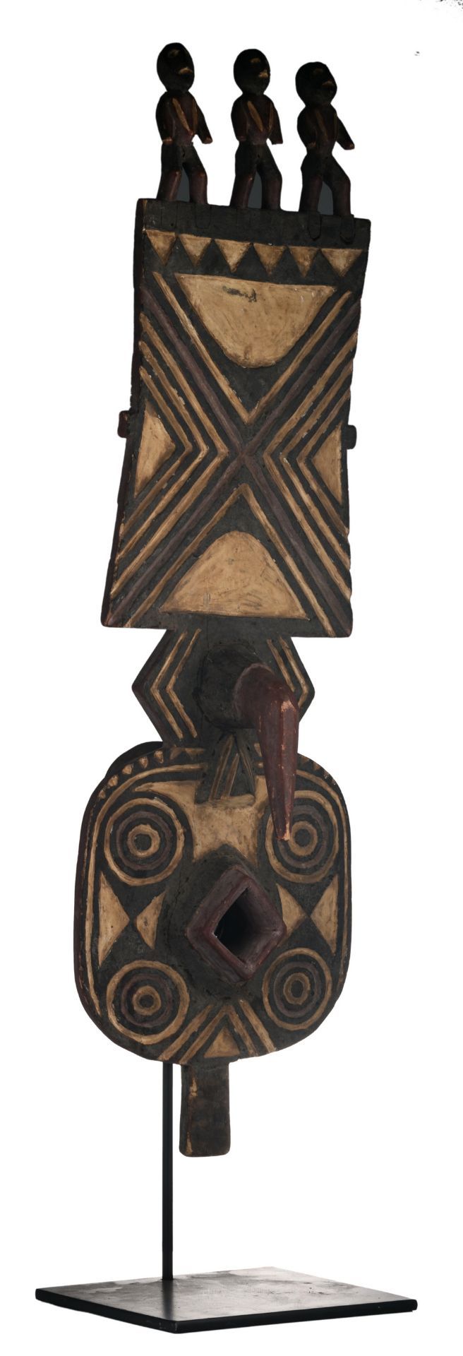 A traditional polychrome decorated African wooden nwantantay plank mask, Bwa - Burkina Faso, H 118