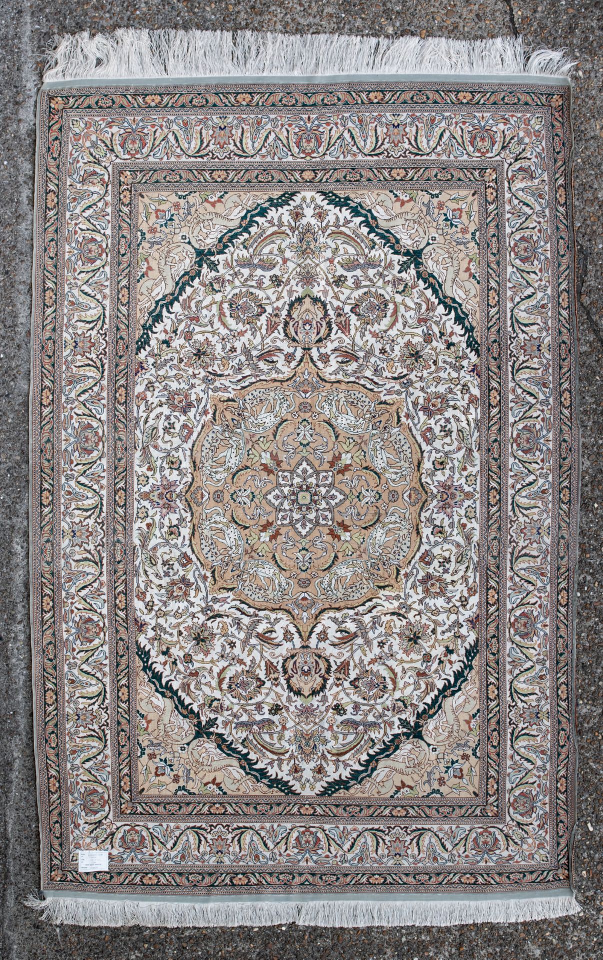 An Oriental floral decorated silk carpet with a central medallion, 127 x 198 cm - Image 2 of 3