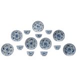 Seven Chinese blue and white cups and saucers, decorated with fish and waterplants, Kangxi,