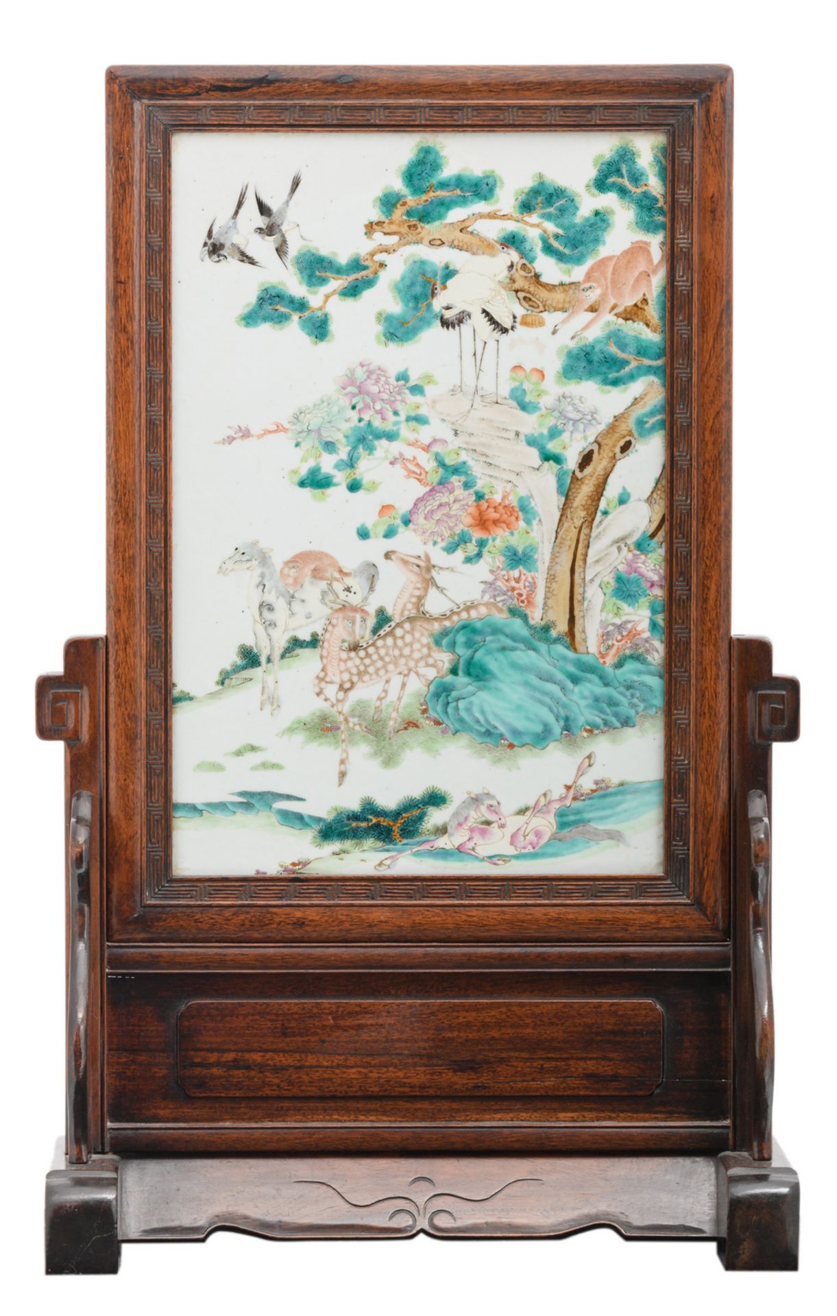 A fine Chinese hardwood table screen, the famille rose plaque decorated with horses, deers,